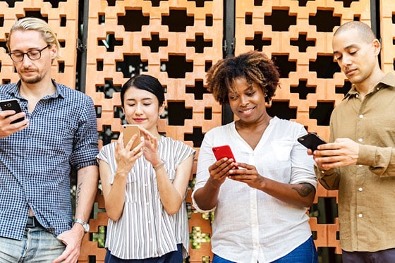 People on their phones participating in Bell Let's Talk Day