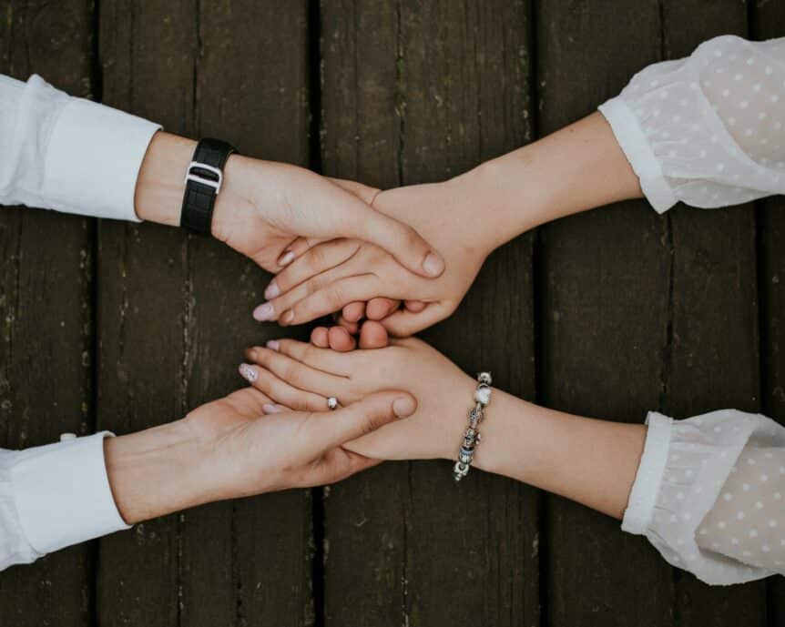 Holding hands to show how to stay connected, hosted by Wellin5