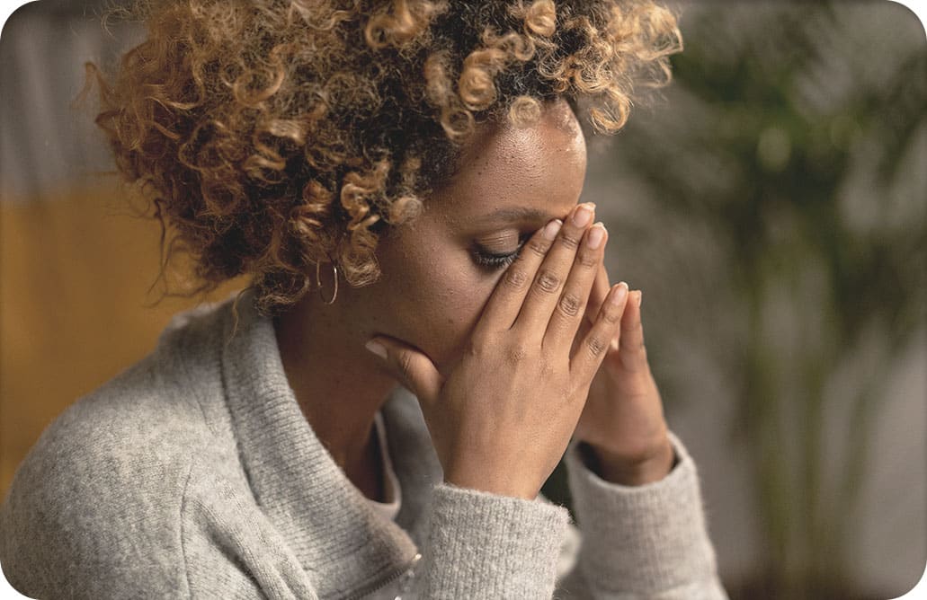 woman with hands on face