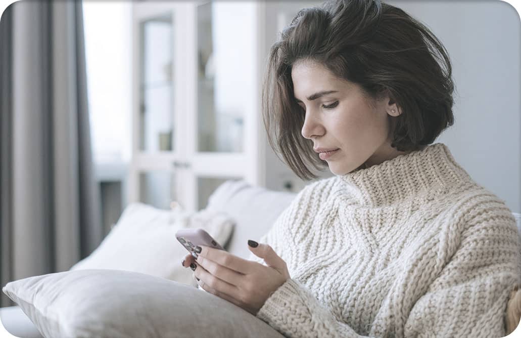 Woman staring at cell phone