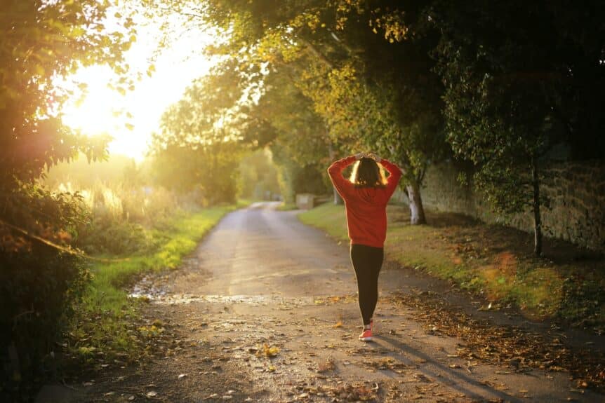 A woman going for a walk to manage burnout, hosted by Wellin5